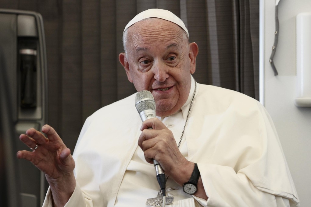 Pope Francis speaks during a news conference aboard the papal plane on his flight back after his 12-day journey across Southeast Asia and Oceania on Friday. Photo: EPA-EFE