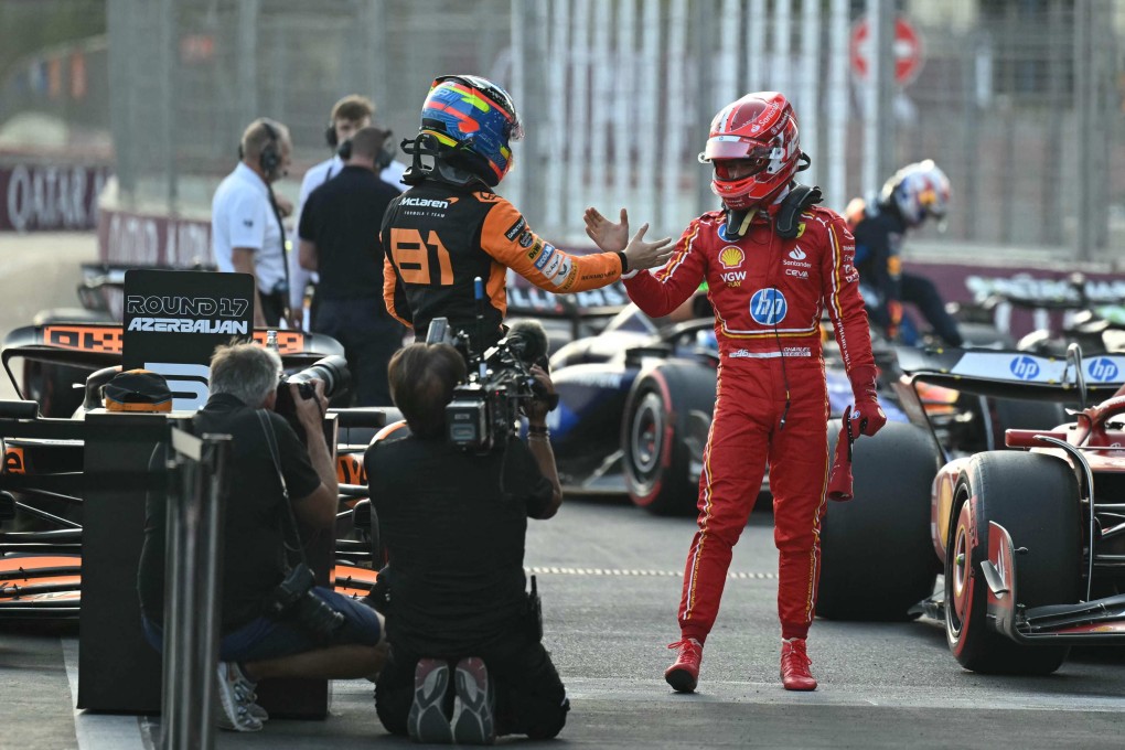 Ferrari’s Charles Leclerc (right) shakes hands with McLaren’s Oscar Piastri after the end of qualifying for the Azerbaijan Grand Prix in Baku. Photo: AFP