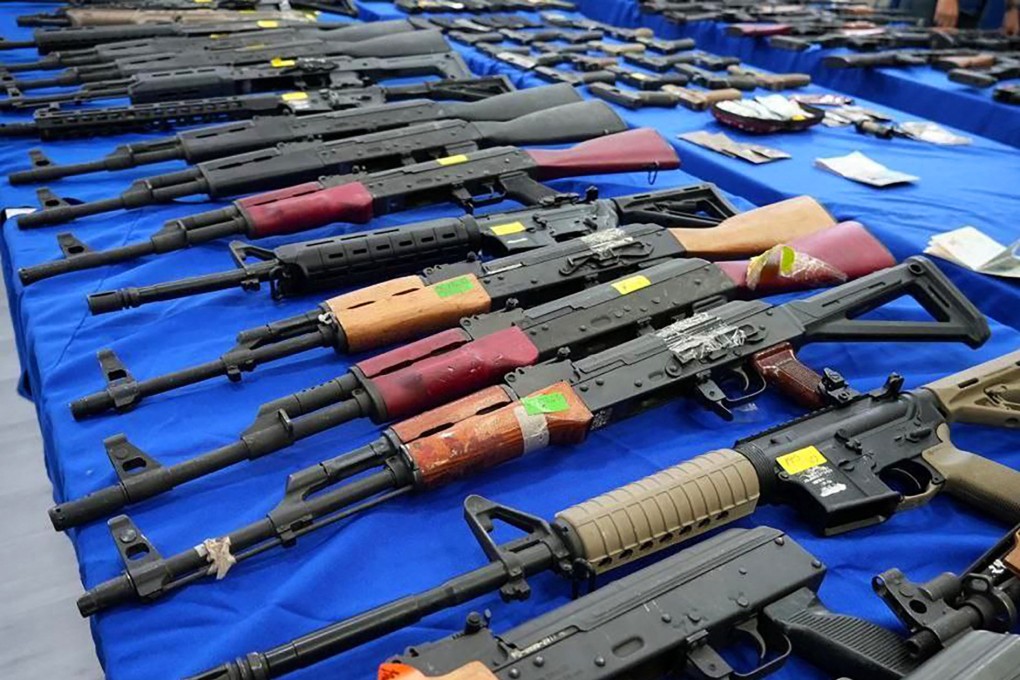 Weapons seized by Venezuelan authorities displayed at a press conference. Six foreigners have been detained in Venezuela on suspicion of plotting to attack President Nicolas Maduro. Photo: AFP