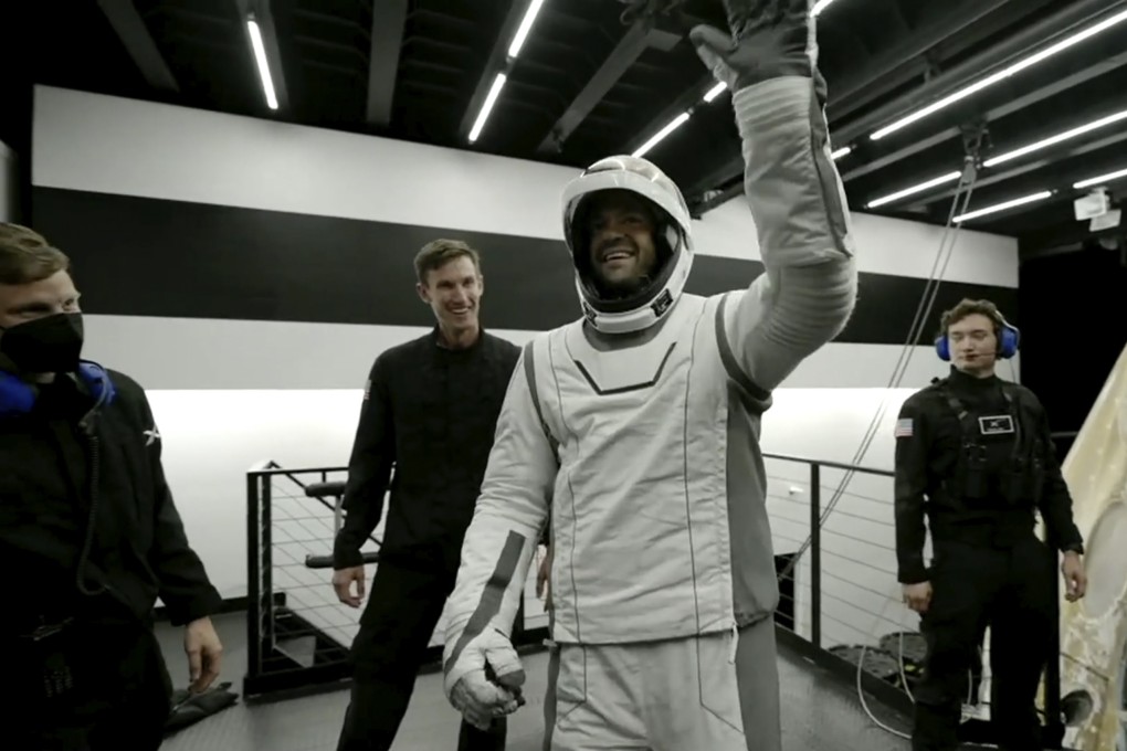 Tech entrepreneur Jared Isaacman reacts upon his return to Earth from space on Sunday. Photo: SpaceX via AP