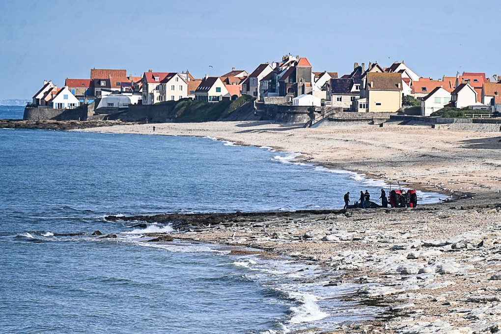 French police pull a damaged migrants’ boat from the sea after a failed attempt to cross the English Channel that led to the death of eight people on Sunday. Photo: AFP