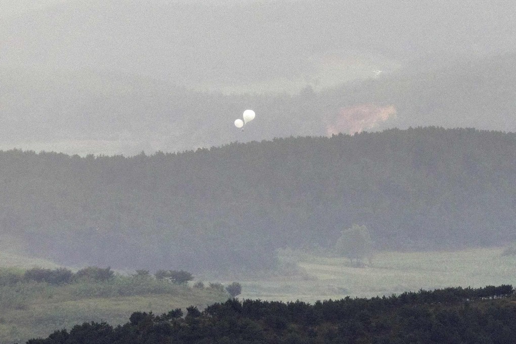 Balloons float over the border towards South Korea earlier this month. North Korea has sent more than 5,000 trash-filled balloons southwards since May. Photo: Yonhap/AFP