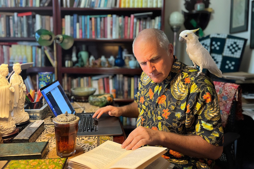 Jason Wordie at work, his pet parrot watching on, as he looks back over 25 years of covering the history and culture of Hong Kong. Photo: courtesy of Jason Wordie