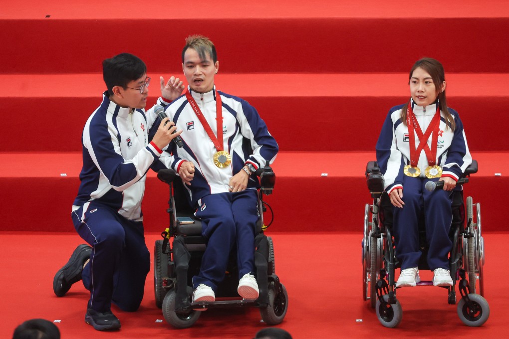 Boccia athletes John Loung (left) and Ho Yuen-kei answer questions during the welcome home ceremony at Ma On Shan Sports Centre. Photo: Edmond So