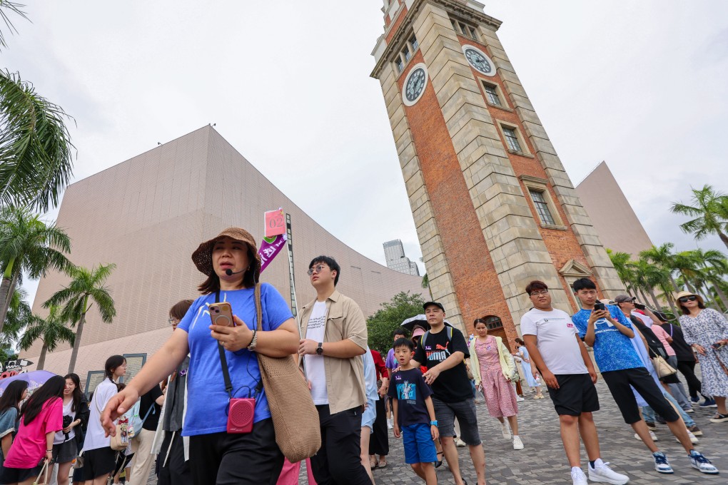Visitors tour the Tsim Sha Tsui area. Hotel industry representatives have suggested moving the annual Wine and Dine Festival there. Photo: Jelly Tse