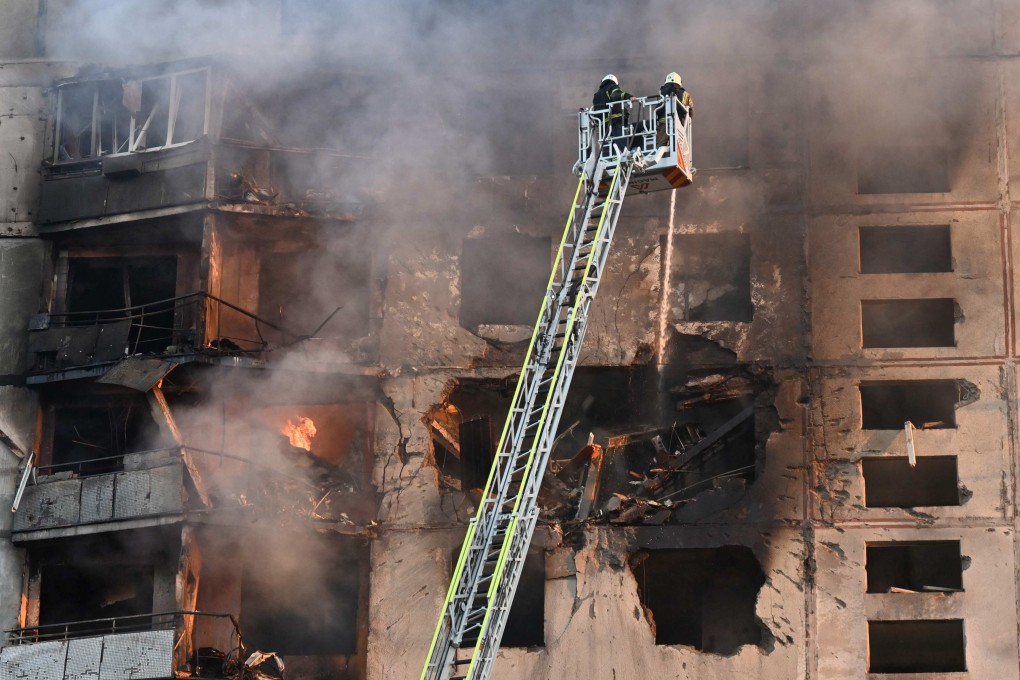 Firefighters tackle a blaze after a Russian aerial bomb struck a block of flats in Kharkiv, Ukraine on Sunday. Photo: AFP