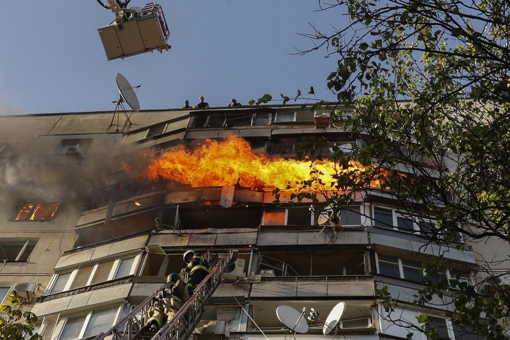 Rescuers work at the site of a damaged residential building after shelling in Kharkiv, in northeastern Ukraine, on Sunday. The US and Nato pressure campaign against China over claims that it is a “decisive enabler” of the Russian war effort has pushed Beijing closer to Moscow. Photo: EPA-EFE