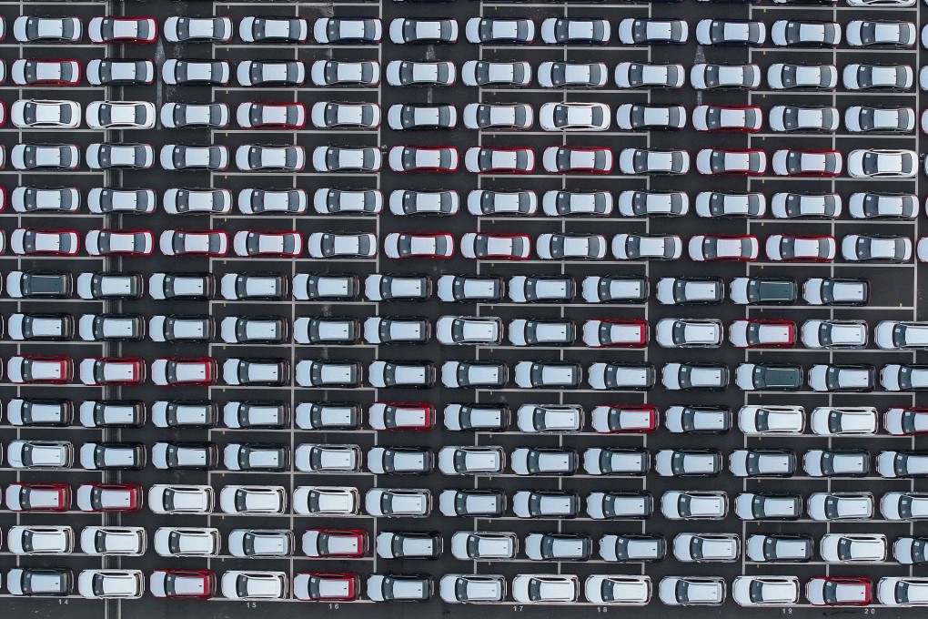 Cars wait to be loaded onto a shipping vessel for export in China’s Jiangsu province last month. Photo: AFP