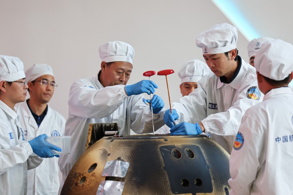 The return capsule of the Chang’e-6 lunar probe is opened during a ceremony at the China Academy of Space Technology under the China Aerospace Science and Technology Corporation in Beijing on June 26. Photo: Xinhua