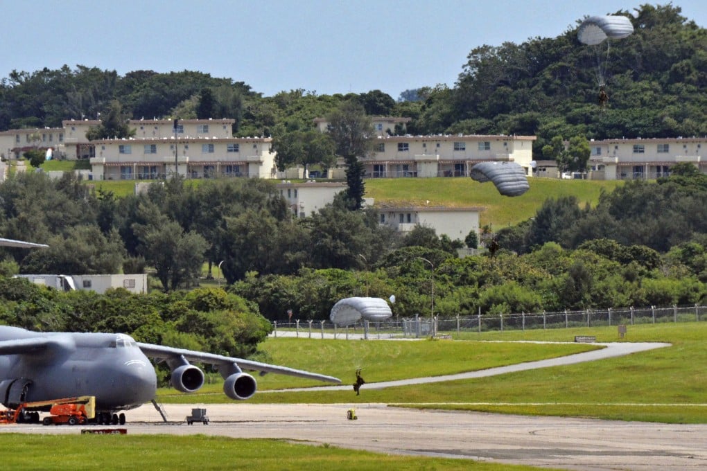 US Air Force personnel conduct a parachute drill at Kadena Air Base in Okinawa, the largest American military installation in the Asia-Pacific. Photo: Kyodo
