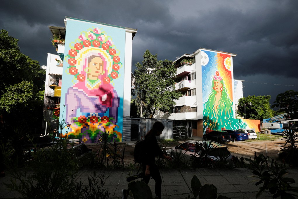 Italian artist Beatrice Vigoni’s murals titled Cryptomadonna of Peace and Pachamama in Zacamil, San Salvador. The initiative in El Salvador’s capital has seen paintings of the Virgin Mary, Mesoamerican pyramids and more brighten up a community scarred by violence. Photo: Reuters