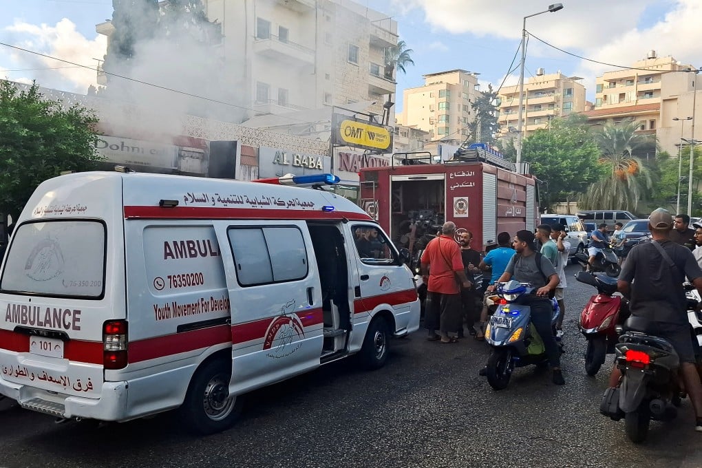 Smoke rises from a mobile shop in Sidon, Lebanon. Photo: Reuters