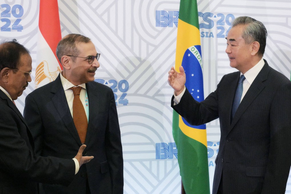 Chinese Foreign Minister Wang Yi (right) greets India’s National Security Adviser Ajit Doval (far left) during a Brics meeting in St Petersburg this month. Photo: brics-russia2024.ru photohost agency / AFP