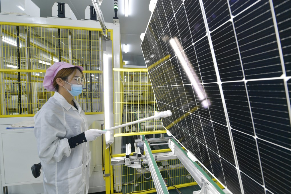 A worker checks photovoltaic modules at a company in Wuwei, Gansu province. Photo: Xinhua