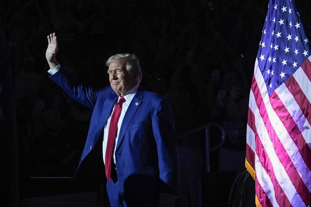 Donald Trump waves to supporters at a town hall event in Flint, Michigan. Photo: AP
