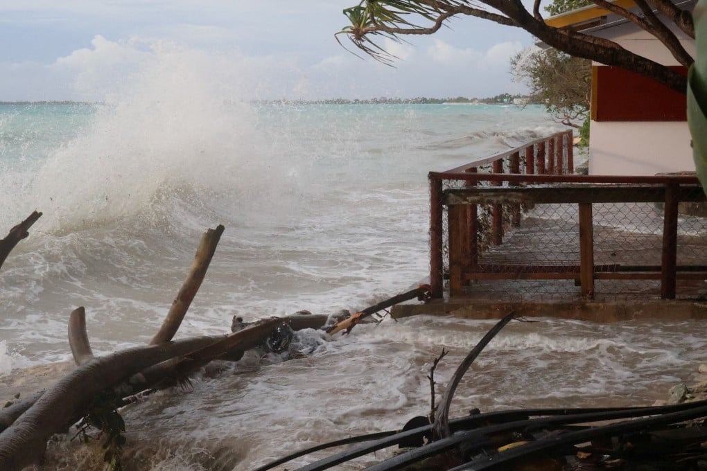 High tides crash ashore in Funafuti, Tuvalu, on February 11. Tuvalu and other low-lying Pacific Island nations face a growing threat of inundation as climate change drives rising sea levels and more intense natural disasters. Photo: Tuvalu Meteorological Service / Reuters