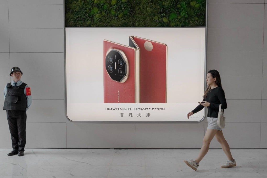 An advertisement for Huawei Technologies’ Mate XT trifold smartphone outside the company’s store in Beijing’s Wangfujing shopping area on September 13, 2024. Photo: Bloomberg