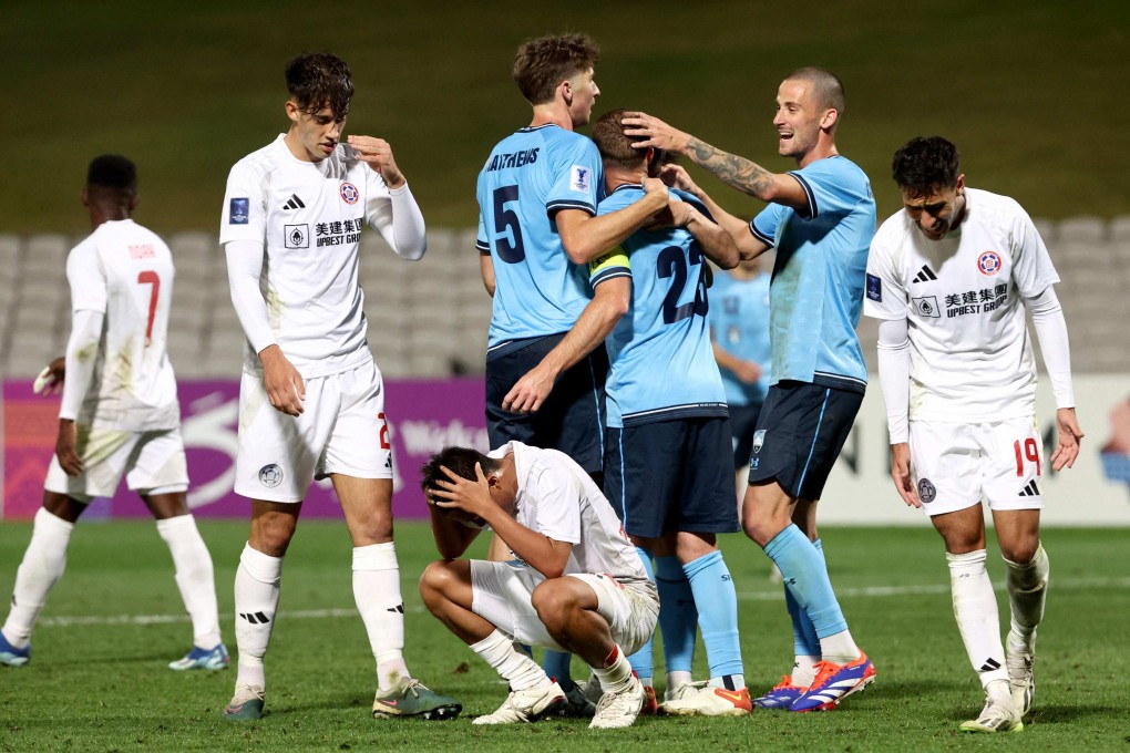Eastern’s crestfallen players come to terms with conceding a cheap second goal to Sydney. Photo: AFP