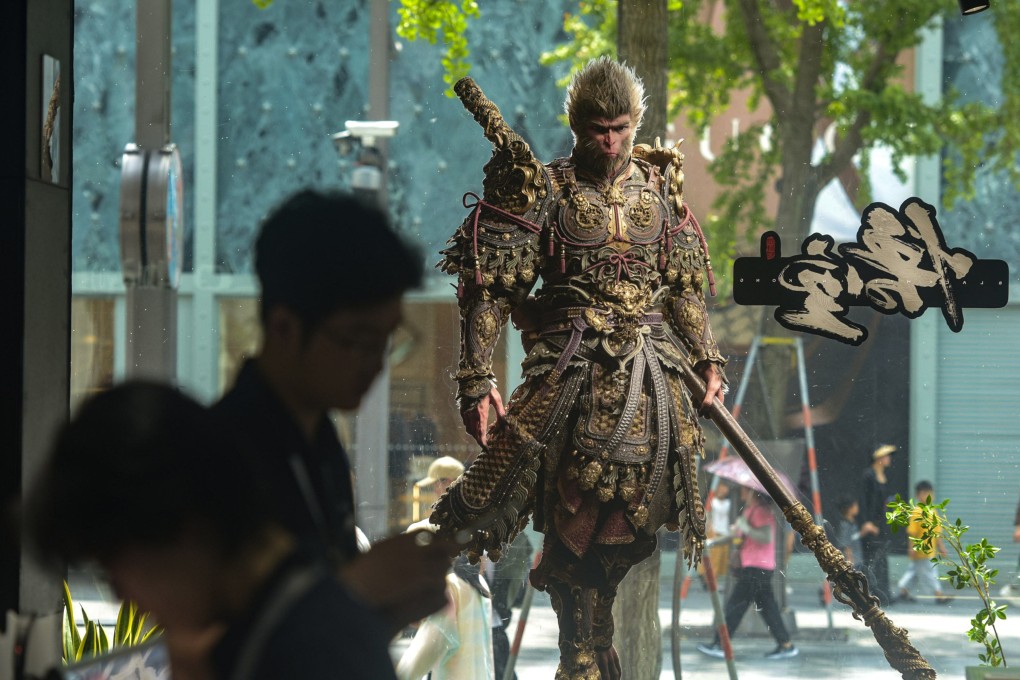 People walk past a poster for the video game “Black Myth: Wukong” in Beijing on August 21. Photo: Xinhua
