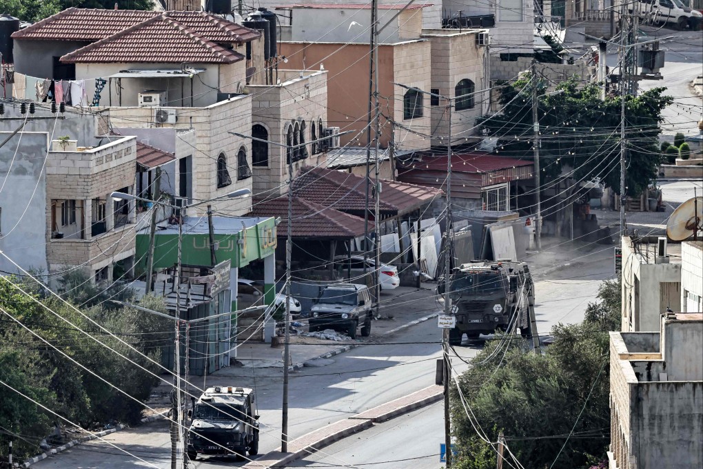 Israeli army vehicles move during an army raid in Qabatiyah, south of Jenin, in the occupied West Bank. Photo: AFP