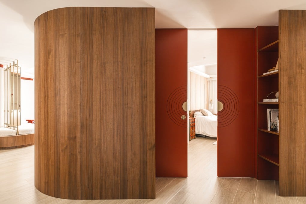 Red sliding bedroom door and bar area encased in American walnut, designed by Craft of Both and made by Mega Concept. Photo: Ken Wong Photography and Craft of Both