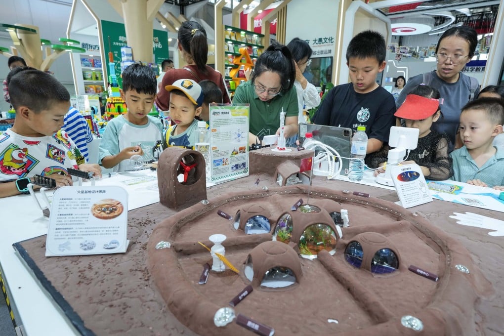 Children and their parents at the 2024 China International Fair for Trade in Services in Beijing. Photo: Xinhua