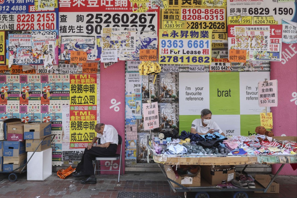 A man takes a nap outside closed shops in Causeway Bay on August 9. Photo: Edmond So