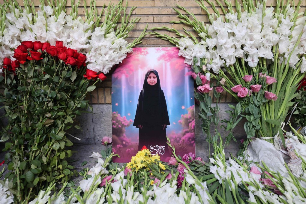 A picture of a child is seen amid flowers placed at a memorial outside Lebanon’s embassy in Tehran, on Wednesday. Photo: AFP