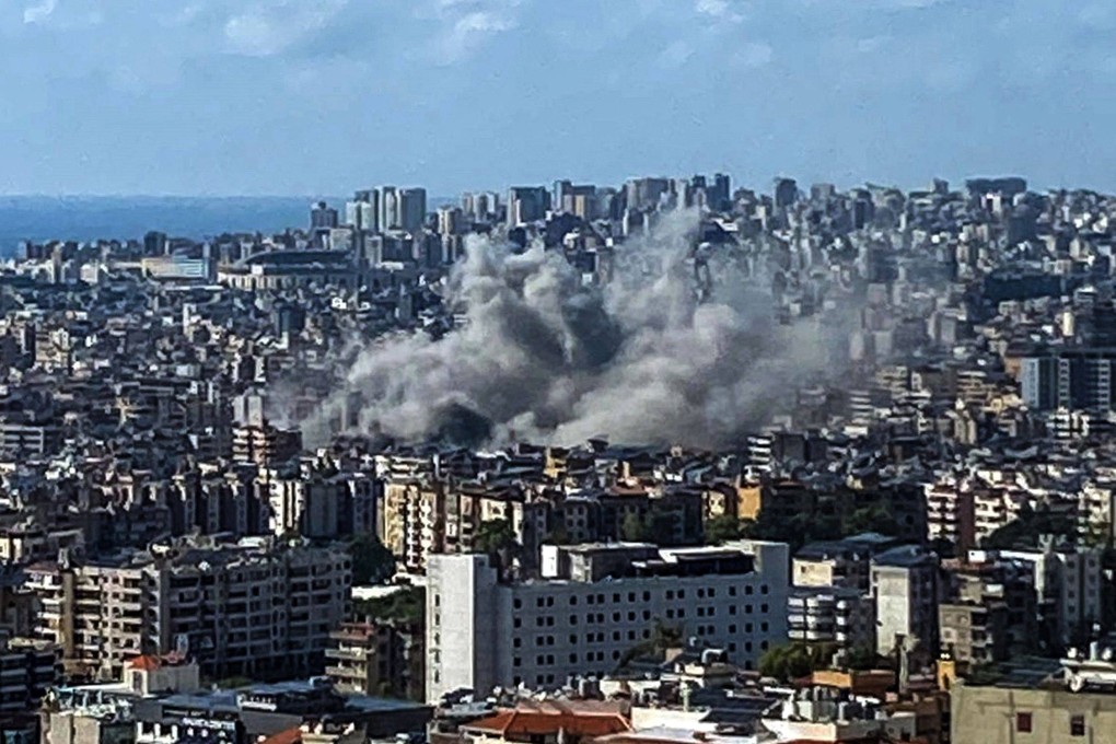 Thick smoke rises above the southern suburbs of Beirut after an Israel strike. The strike on Hezbollah’s stronghold in Lebanon’s capital reportedly killed at least eight people and wounded dozens of others, with a source close to the movement saying a top military leader was dead. Photo: AFP
