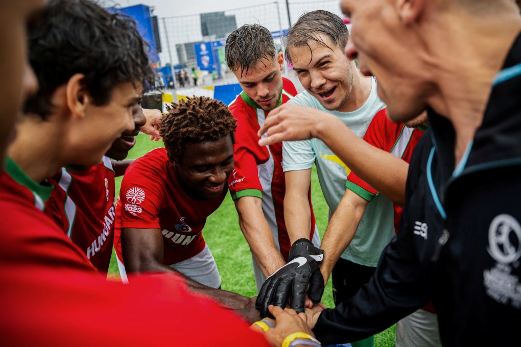 Hungary team members encourage each other before the match against Italy at the Homeless Euro 2024 tournament. Photo: Reuters