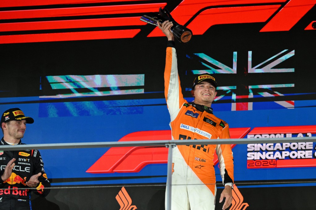 McLaren’s Lando Norris celebrates on the podium after winning the Singapore Grand Prix. Photo: Reuters