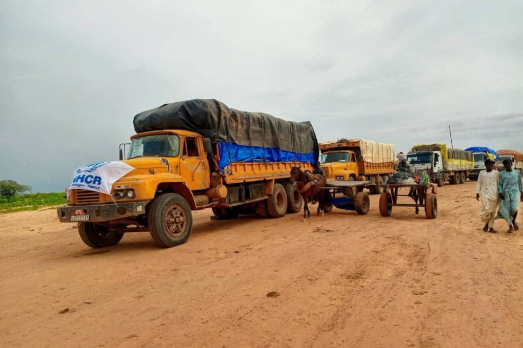 Aid trucks bound for Sudan’s Darfur region, at a location given as the border of Chad and Sudan, August 21, 2024. Photo: UNHCR via Reuters