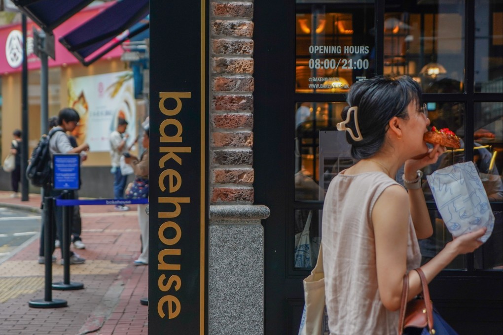 Customer enjoying a pastry outside a Bakehouse store, Causeway Bay. Photo: Alexander Mak.