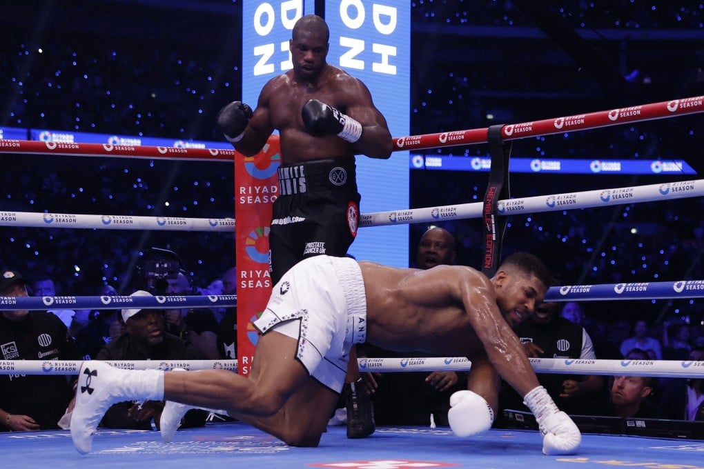 Anthony Joshua gets knocked down by Daniel Dubois at Wembley Stadium. Photo: Reuters