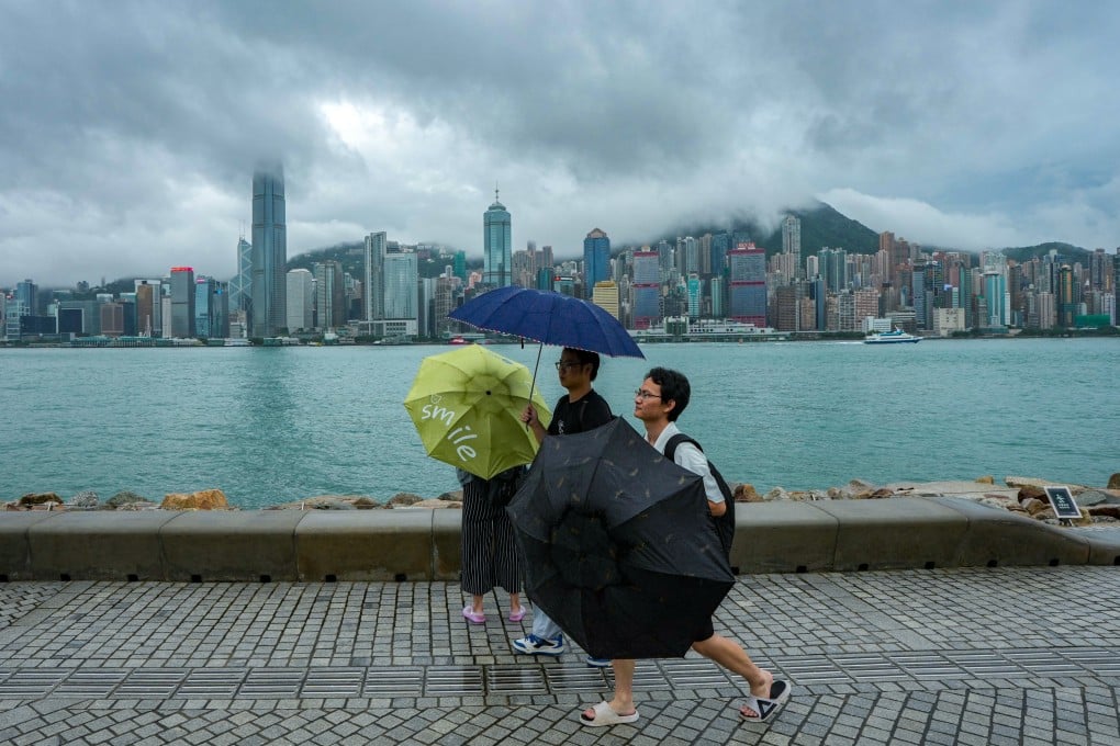 Visitors along the waterfront at West Kowloon Art Park on a rainy day. Photo: Eugene Lee