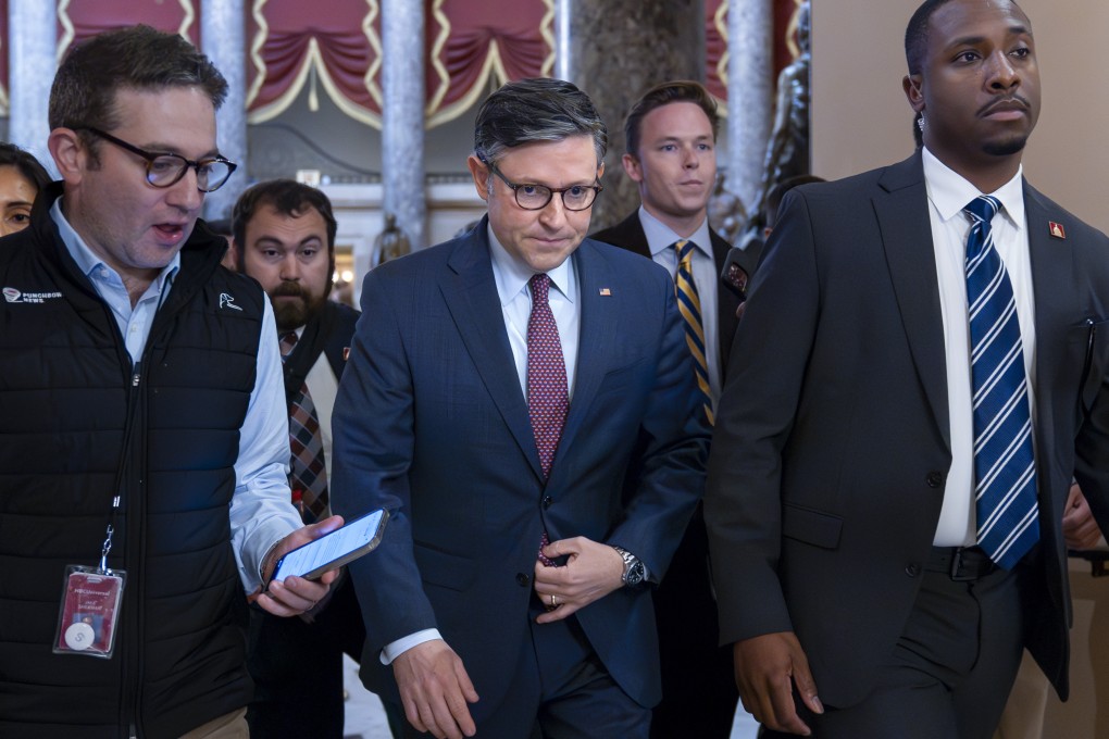 US House Speaker Mike Johnson, centre, at the Capitol in Washington on Friday. Photo: AP