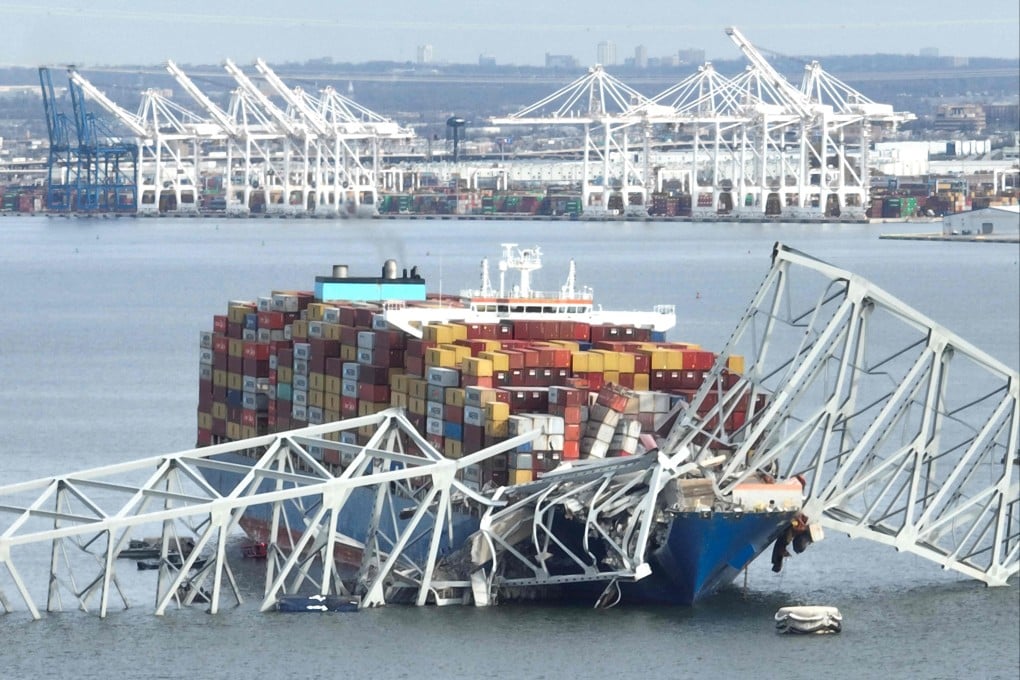 What remains of the Francis Scott Key Bridge after its collapse sits atop the Singapore-flagged Dali container ship in Baltimore on March 26. Photo: AFP