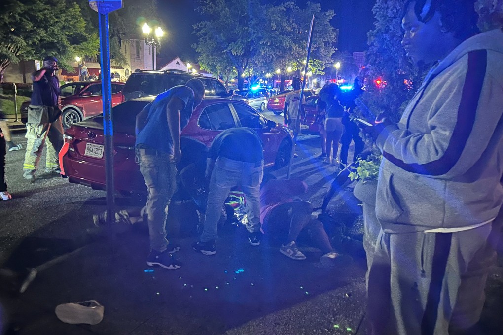 Victims lie on the ground as police respond to the deadly shooting. Photo: Drew Hawkins, Gulf States Newsroom via Reuters