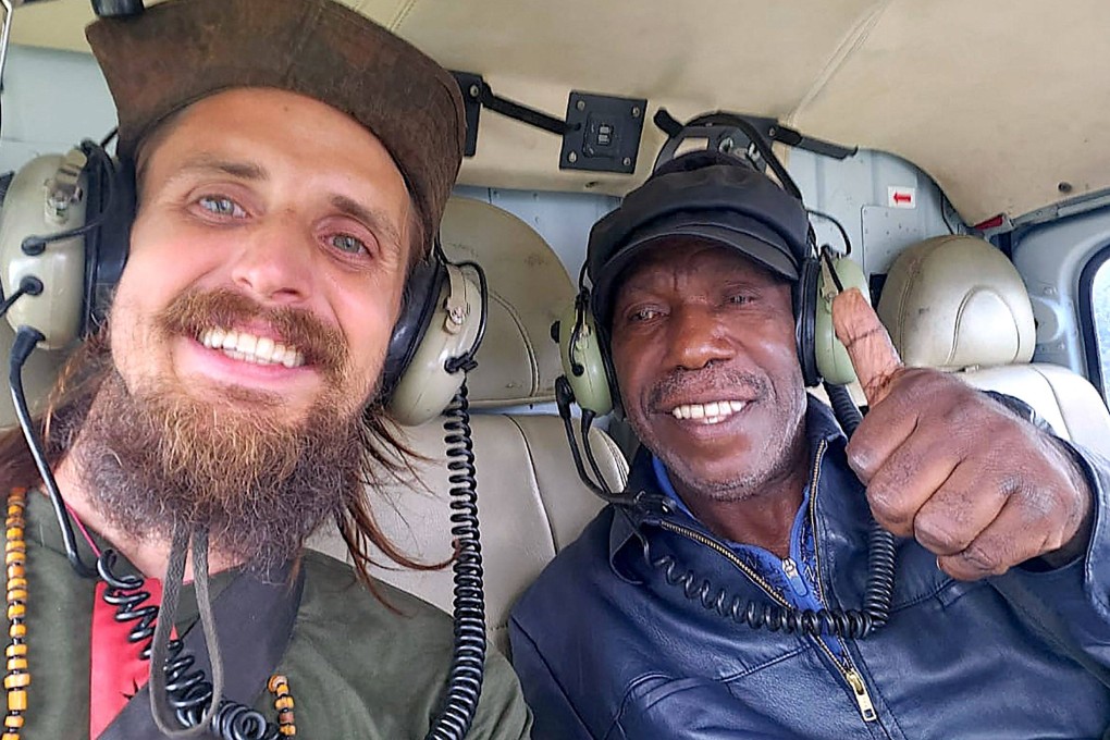 Phillip Mehrtens (left) pictured with Edison Gwijangge after being released from captivity on Saturday. Rebels in Indonesia’s Papua region claimed they received money for Mehrtens’ release. Photo: New Zealand Ministry of Foreign Affairs and Trade / AFP