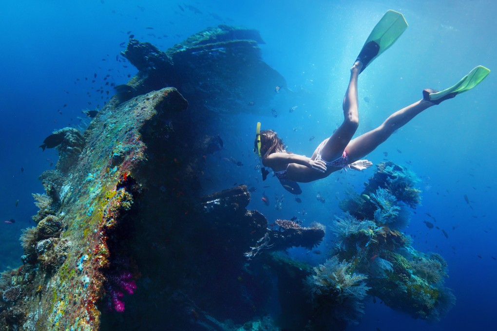 The wreck of USAT Liberty off Tulamben, Bali, Indonesia, is shallow enough for snorkelling, and is one of thousands of second world war wrecks divers can explore in Southeast Asian waters. Photo: Shutterstock