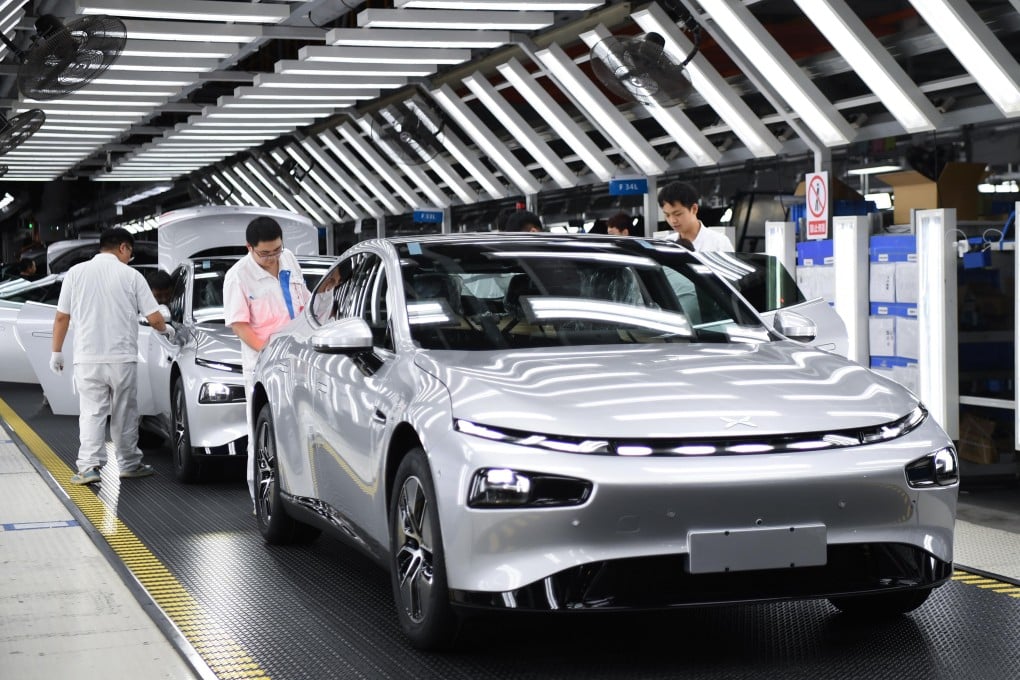 Workers check an Xpeng can at a plant in Zhaoqing, in southeast China’s Guangdong province, on October 09, 2023. Photo: Xinhua