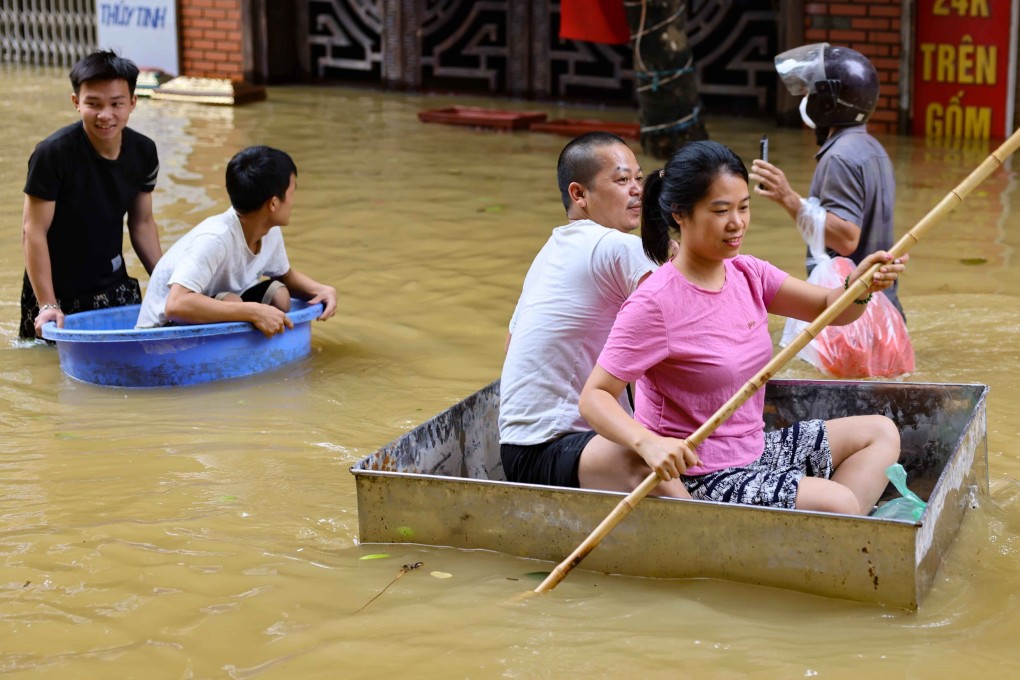 People paddle makeshift rafts to move to safe areas in Gia Lam District, Hanoi, Vietnam, on September 12, 2024 after Typhoon Yagi swept through. Photo: Xinhua