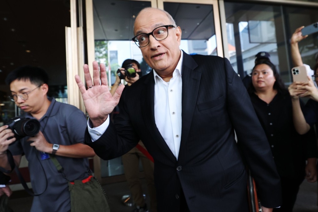 Singapore’s former transport minister S. Iswaran (centre) arrives at court in Singapore on Tuesday. Photo: EPA-EFE