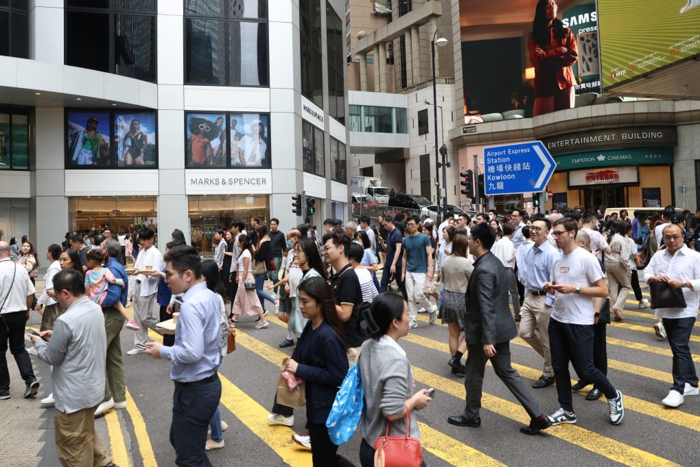Commuters cross a street in Hong Kong’s Central district on May 17, 2024. Photo: Yik Yeung-man