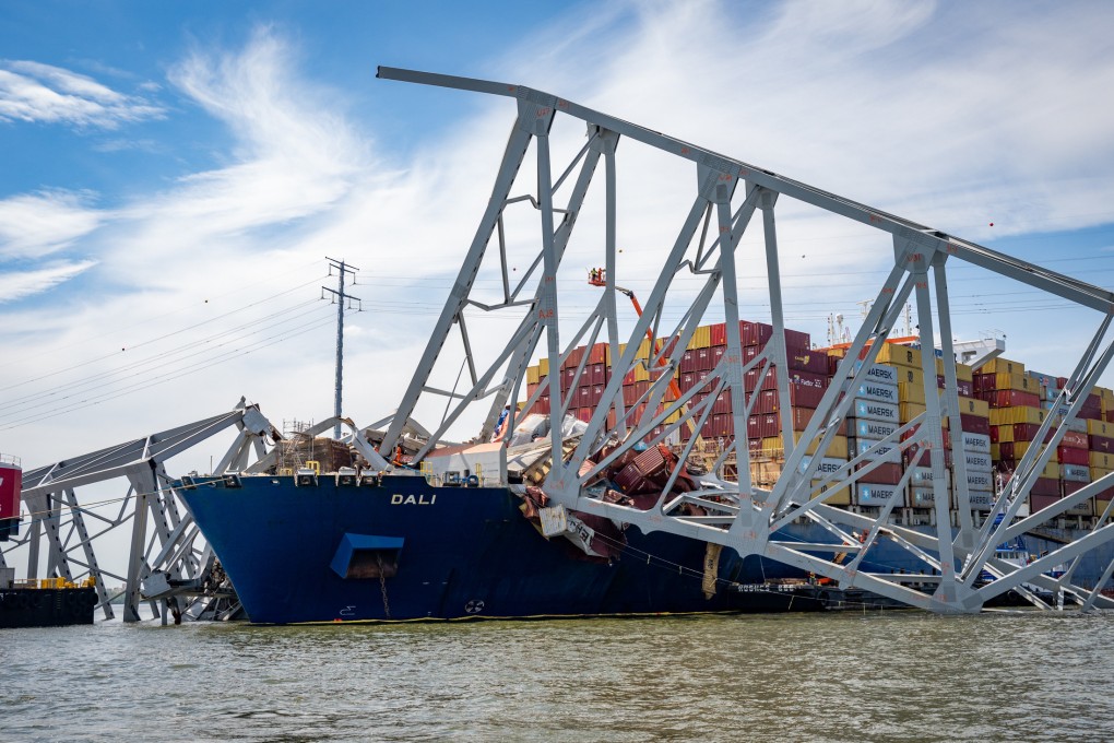 Workers prepare to remove the wreckage of the Francis Scott Key Bridge from the container ship Dali in April, five weeks after the catastrophic collapse. Photo: Baltimore Sun via TNS