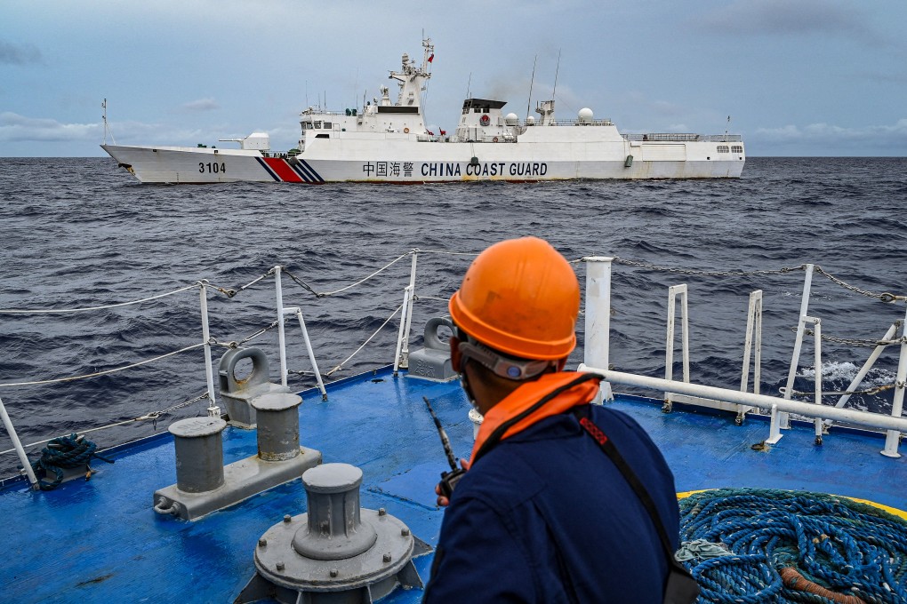 A Chinese coastguard ship is seen from the Philippine coastguard vessel BRP Cabra during a supply mission to Sabina Shoal on August 26. Photo: AFP/Getty Images/TNS