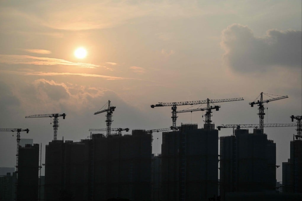 Buildings under construction are seen during sunset in Shanghai on September 6, 2024. Photo: AFP