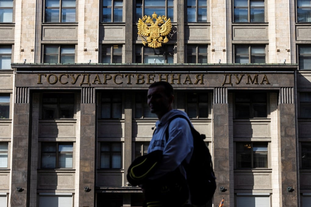 A man passes by the State Duma building, the lower chamber of Russian parliament in Moscow. Moscow has long portrayed itself as a bulwark against liberal values, but that trend has hugely accelerated since the Ukraine war. Photo: Reuters