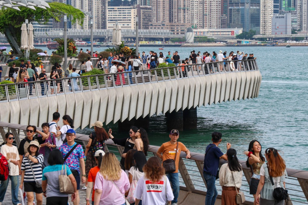 Tourists visit Avenue of Stars in Tsim Sha Tsui. Some 850 mainland Chinese groups are expected in Hong Kong over the National Day holiday. Photo: Jelly Tse
