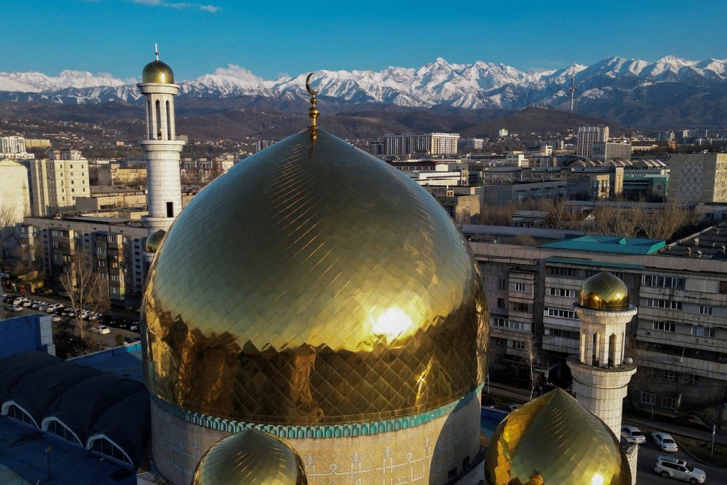 A drone view shows domes of the Central Mosque with the backdrop of the Tien Shan Mountains in Almaty, Kazakhstan, on April 7. Last year, Kazakhstan became a net importer of electricity as it struggled with a power deficit. Photo: Reuters